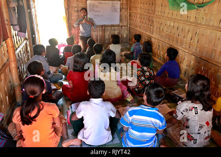 Rohingya refugee children attend class at a temporary school in ...