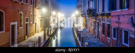 Panorama of colorful houses and canal at dusk, Venice, Italy Stock Photo