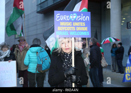 Pro-Palestine demonstrators gather holding banners and placards ...