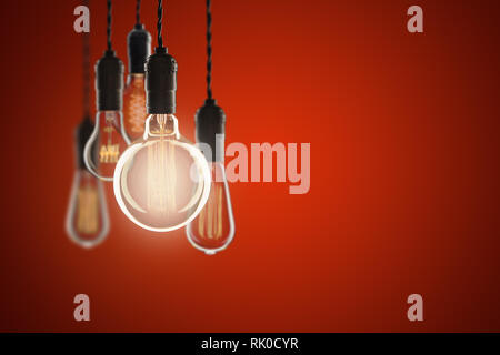 Idea and leadership concept Vintage bulbs on color wall background, copy space for text