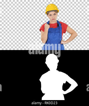 On Alpha Matte. Medium shot. Woman with protective helmet showing fist to camera Did something wrong, Alpha Channel Professional shot in 4K resolution Stock Photo