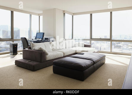 Living room and home office in luxury highrise apartment Stock Photo