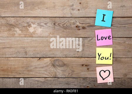 I love you inscription on colorful stickers on blackboard Stock Photo