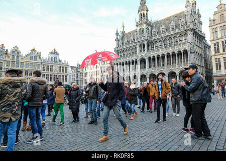 Brussels, Belgium - Guided tour in front of the Maison du Roi with the city museum and guild halls at the Grand Place in Brussels, Brüssel, Belgien - Stock Photo