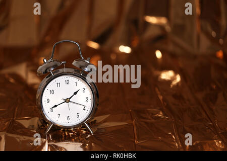 The old alarm clock on a light background Stock Photo