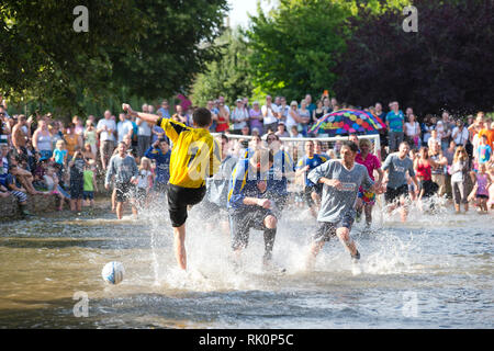 Teams play water football in the River Windrush Bourton on the water in the Cotswolds. 23 August 2013. Stock Photo
