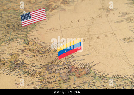 Flags of the USA and Venezuela on the world map. Conceptual photo, politics and world order Stock Photo