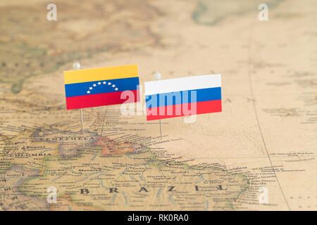 Flags of Russia and Venezuela on the world map. Conceptual photo, politics and world order Stock Photo