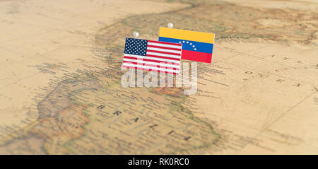 Flags of the USA and Venezuela on the world map. Conceptual photo, politics and world order Stock Photo