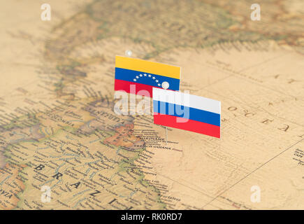 Flags of Russia and Venezuela on the world map. Conceptual photo, politics and world order Stock Photo