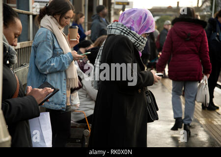 Hackney Central Station. London. Commuters wait for a train to Stratford. Stock Photo