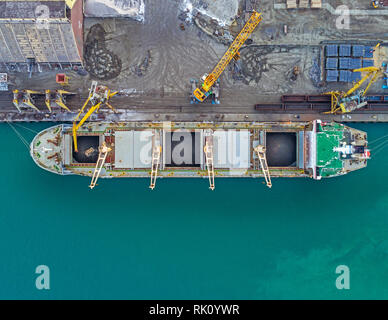 The Cargo Ship is in the Port Burgas at the Loading . Aerial View from Drone. Location Burgas Town, Bulgaria Stock Photo