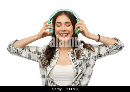 happy young woman or teenage girl with headphones Stock Photo