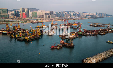 Barges carry out construction works near the To Kwa Wan typhoon shelter in Hong Kong Stock Photo