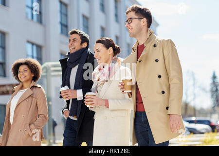 office workers with coffee on city street Stock Photo
