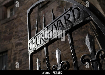 Iron gates at entrance to Greyfriars Churchyard on Candlemakers Row in Edinburgh Old Town, Scotland, UK Stock Photo