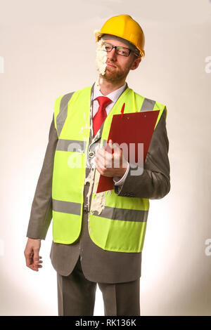 Health and Safety office getting hit in the face with a cream pie Stock Photo