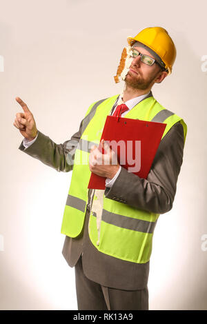 Health and Safety office getting hit in the face with a cream pie Stock Photo