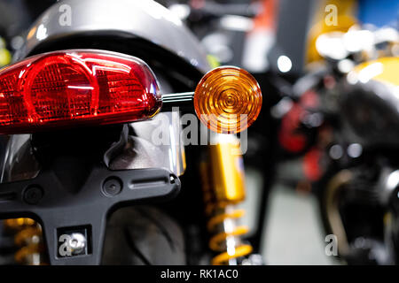 Close up of the rear of a brand new clasic motorcycle, soft focus, abstract background - Image Stock Photo