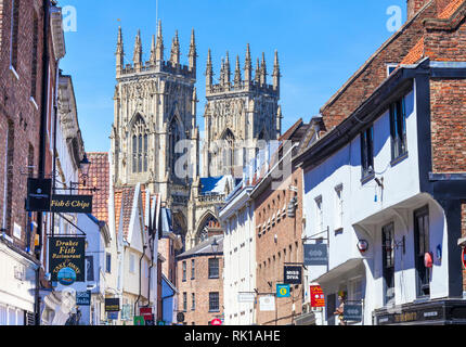 York Minster and shops on Low Petergate York Yorkshire England gb uk Europe York England Stock Photo