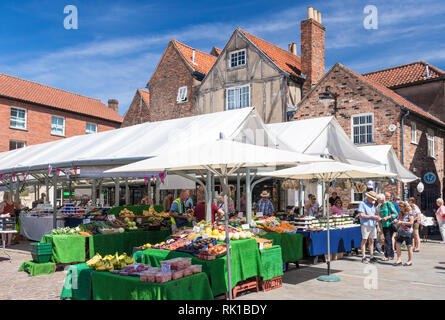 People shopping around a greengrocers fruit and veg stall in the Shambles Market York city centre York  North Yorkshire England GB UK EU Europe Stock Photo