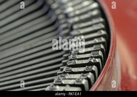 A closeup of the letter blocks on the striker arms of an antique typewriter. Stock Photo