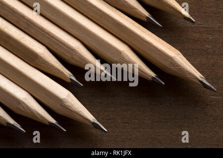 Wooden pencils on brown background Stock Photo