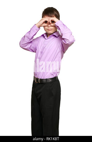 Boy posing on white background, black trousers and purple shirt Stock Photo