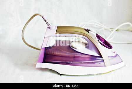Modern electric iron with steam generator isolated on a white background. Stock Photo