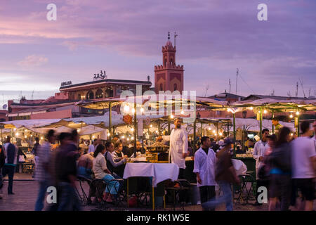 Marrakesh, Morocco; view of the Djemaa el Fna at sunset. Stock Photo