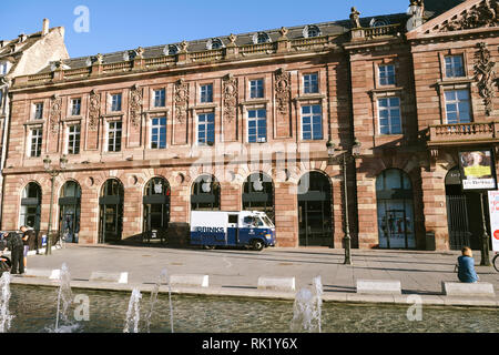 STRASBOURG, FRANCE - SEP 12, 2018: Brinks armored security truck cash transportation from Apple Store in France - water fountain Aubette building Stock Photo