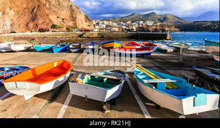 Traditional fishing boats,sea and house in Puerto de Sardina village,Gran Canaria,Spain.
