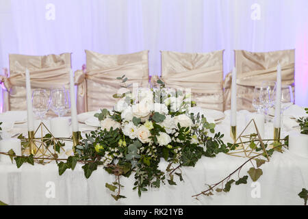 Table set for an event party or wedding reception, luxury elegant table setting dinner Stock Photo