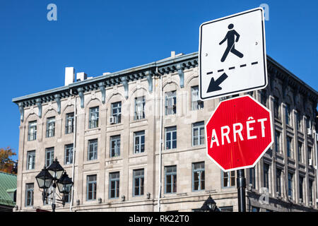 Quebec Stop Sign, obeying by bilingual rules imposing use of French language on roadsigns, translatingStop into Arret, taken in Montreal, Canada, next