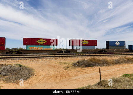 Double stacked shipping containers on a freight train at Port Augusta South Australia Stock Photo