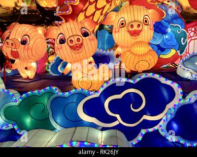 3 happy pigs as part of Chinese New Year decoration in Yuyuan Garden. 02/07/2019. Shanghai, China. Stock Photo