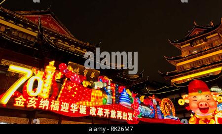 Colorful, illuminated Chinese New Year decoration and traditional Chinese architecture in Yuyuan Garden. 02/07/2019. Shanghai, China. Stock Photo