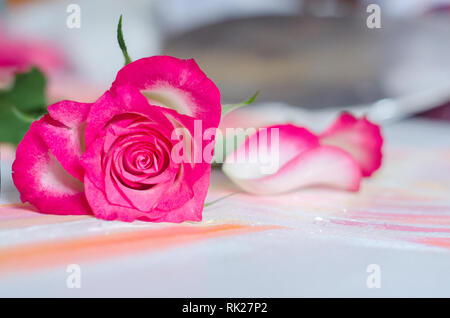 Pink rose in the shape of a heart on a blurred wooden background.Photo for in love, Valentin's day concept. Stock Photo
