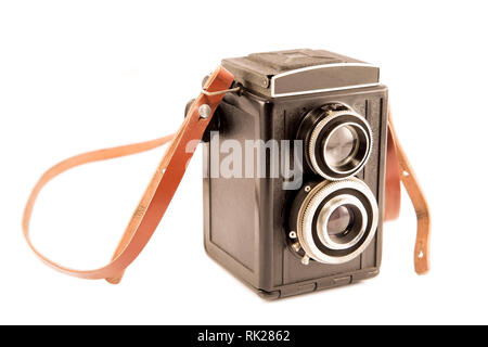 Old camera with the leather strap Stock Photo
