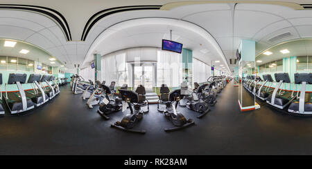 360 degree panoramic view of MINSK, BELARUS - JANUARY, 2017: Full spherical panorama 360 angle view Inside of interior of big stylish fitness club with sport simulators in equirec