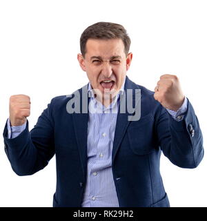 Businessman enjoying himself and shouting after a winning and successful business fight Stock Photo