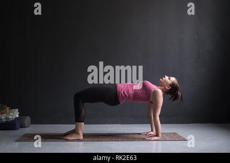 woman practicing yoga concept, doing Purvottanasana exercise, Upward Plank pose Stock Photo