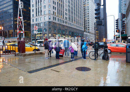 CHICAGO, IL - CIRCA APRIL, 2016: streets of Chicago at evening. Chicago, colloquially known as the 'Windy City', is the third most populous city in th Stock Photo