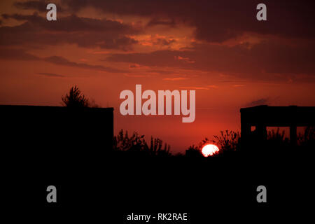 Sun set building in dark shadow Stock Photo
