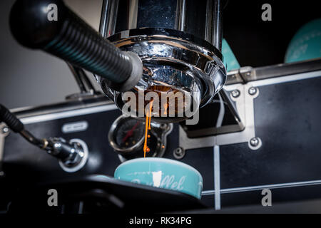 a shot of espresso being poured, close-up Stock Photo