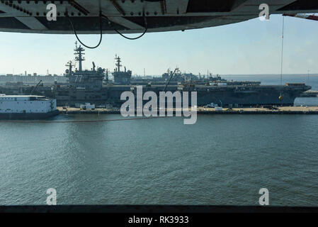 190208-N-GY475-0004 NORFOLK, Va. (Feb. 8, 2019) The Nimitz-class aircraft carriers USS George H.W. Bush (CVN 77) and USS Dwight D. Eisenhower (CVN 69) sit alongside USS Harry S. Truman (CVN 75). Harry S. Truman is currently moored at Naval Station Norfolk conducting targeted maintenance and training, and remains operationally ready. (U.S. Navy photo by Mass Communication Specialist 3rd Class Joseph A.D. Phillips/Released) Stock Photo