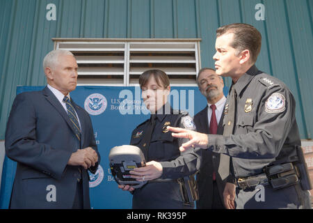 U.S. Customs and Border Protection Deputy Commissioner Robert E. Perez, right, talks with Vice President of the United States Mike Pence as he visits U.S. Customs and Border Protection operations at Dundalk Marine Terminal within the Port of Baltimore in Baltimore, Md., February 8, 2019. U.S. Customs and Border Protection Photo by Glenn Fawcett Stock Photo