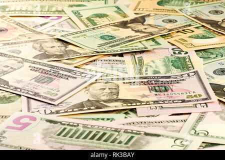A close-up view of a stack of US five and ten, twenty and fifty dollar bills Stock Photo