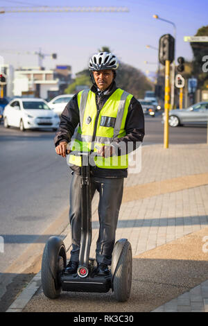 Johannesburg, South Africa, 24 August - 2018: Security guard on a self-balancing personal transporter. Stock Photo