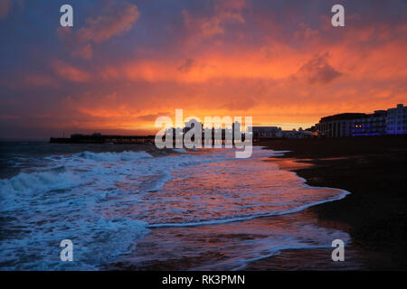 Southsea, Portmsouth. 8th Feb 2019. UK Weather: Red sky at night, sunset lights up the sky behind Southsea Pier after Storm Erik battered the seafont at Portsmouth, UK, Friday February 8, 2019 Photograph : Credit: Luke MacGregor/Alamy Live News Stock Photo